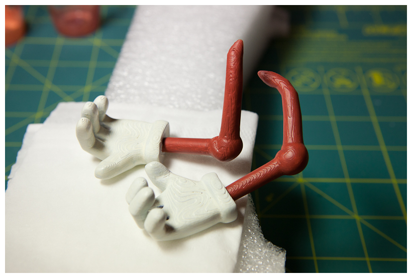 Arm painted dark brown like tree branch