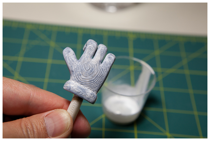 Hands painted with white over black base shading